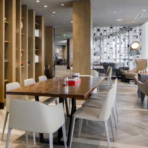 a clubroom with a table and chairs