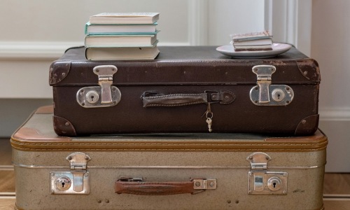 a stack of suitcases on the floor
